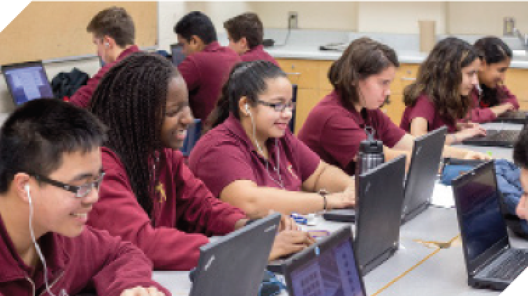 students using laptops in class